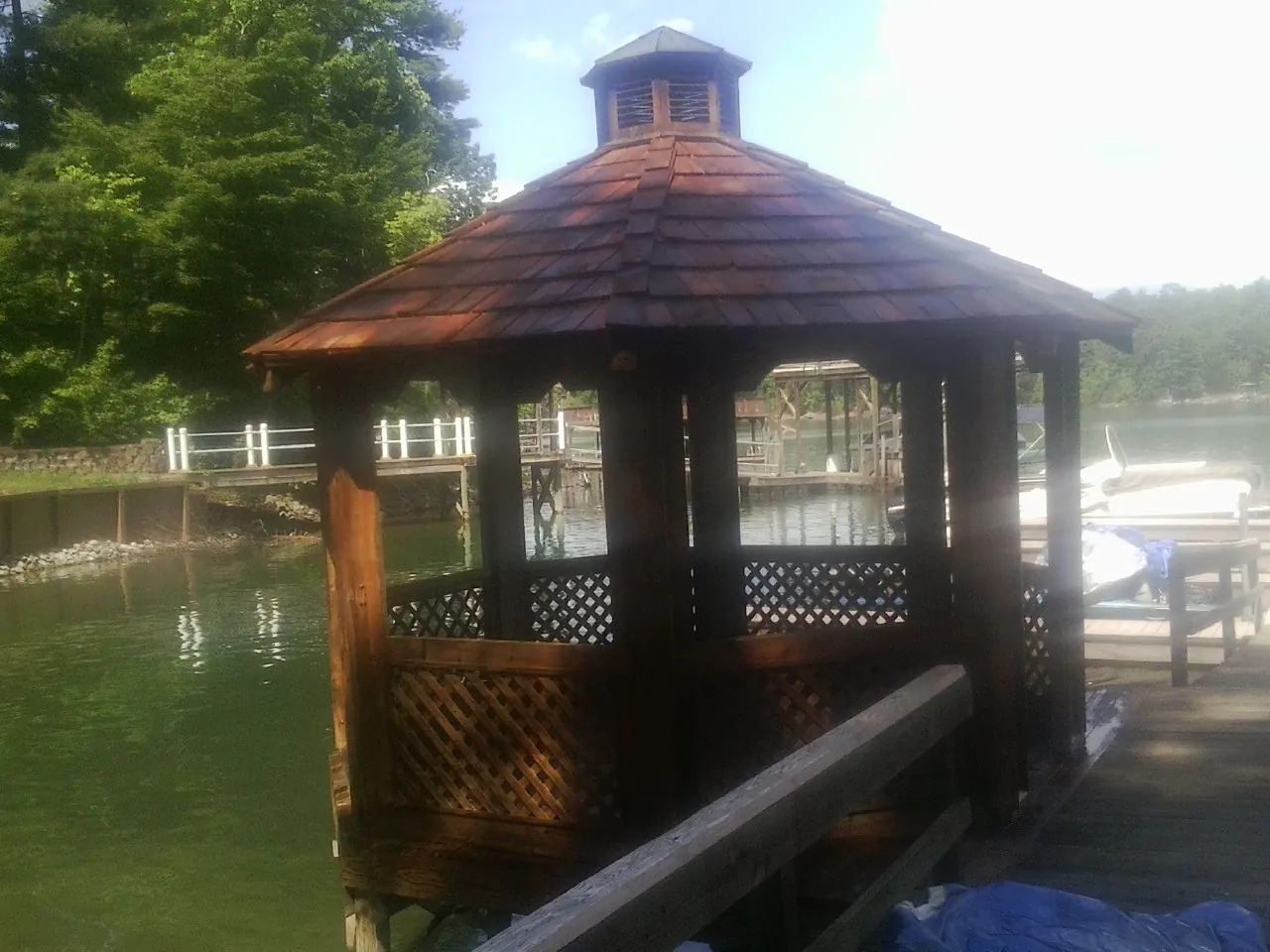 Cedar shake gazebo roof rebuilt on a lake dock in New Baltimore